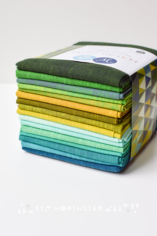 Mountain Meadow Handloom fat quarter bundle by Tara Faughnan featuring 16 green, teal, and yellow woven fabrics.