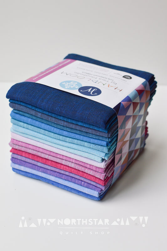 Folded Morning Glory yarn-dyed woven fat quarter bundle for quilting.