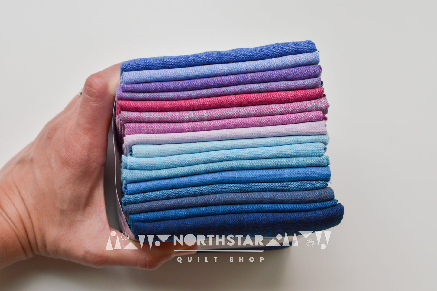 Close-up of Morning Glory woven cotton fabrics showing rich texture and color variation.