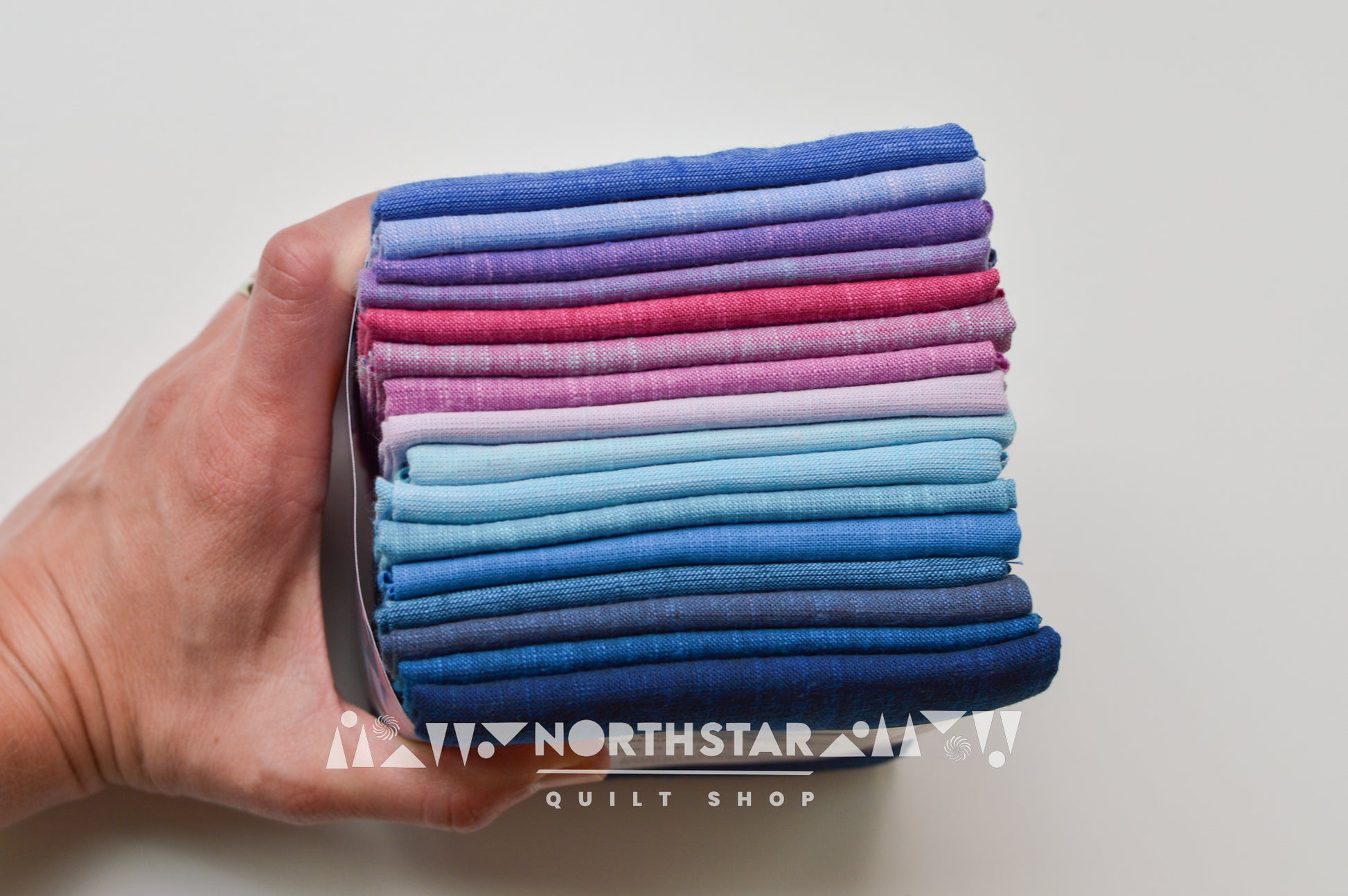Close-up of Morning Glory woven cotton fabrics showing rich texture and color variation.